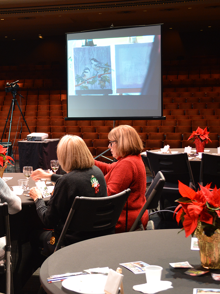 Photo of ladies participating in watercolor painting fun