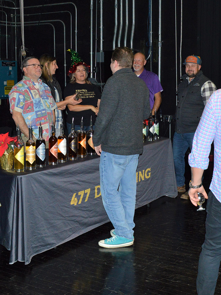 Photo of customers at the Whiskey Wonderland table