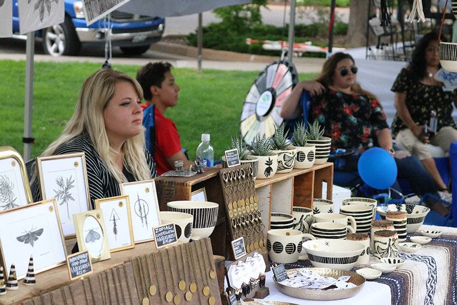 Photo of a vendor displaying arts and crafts at the Greeley Arts Picnic