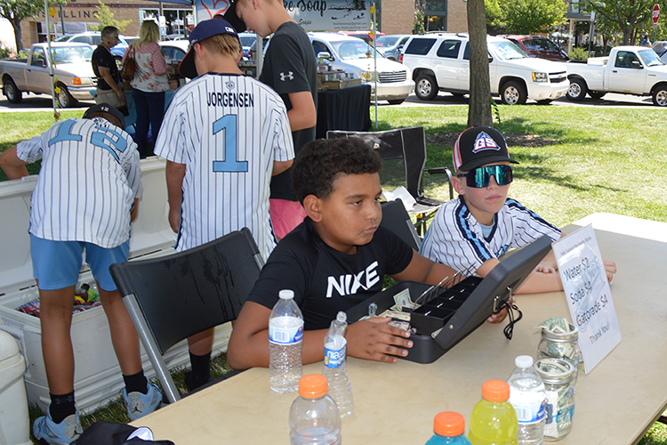 Young vendor at Arts Picnic 2023