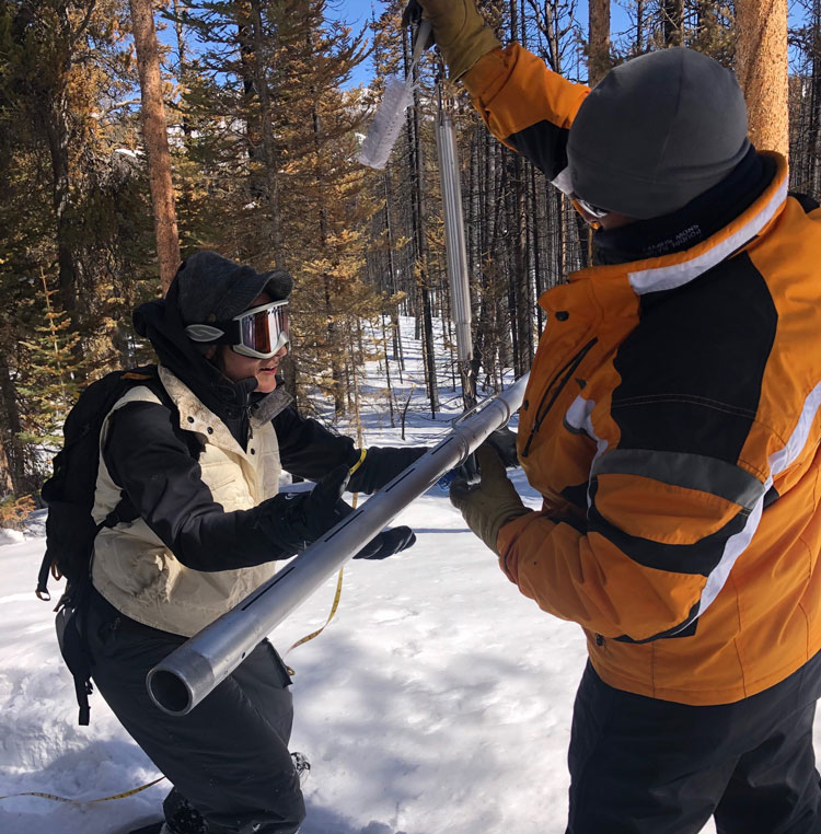 Two Water and Sewer workers taking a snow survey.